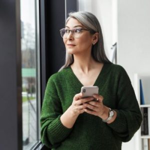 photo-of-gray-haired-serious-businesswoman-using-cellphone-e1598443848267.jpg